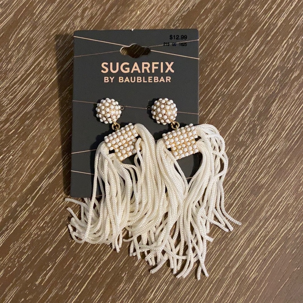White tassel earrings.